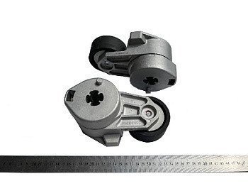 Натяжний пристрій приводу вентилятора